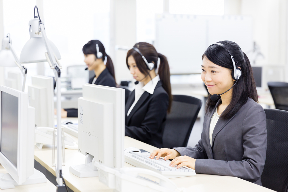 This is a photo of a call center with Japanese phone attendants.